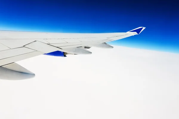 View of the wing of an airplane through the window