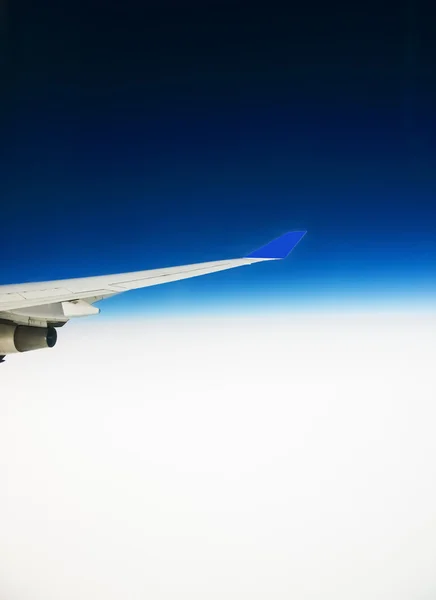 View of the wing of an airplane through the window