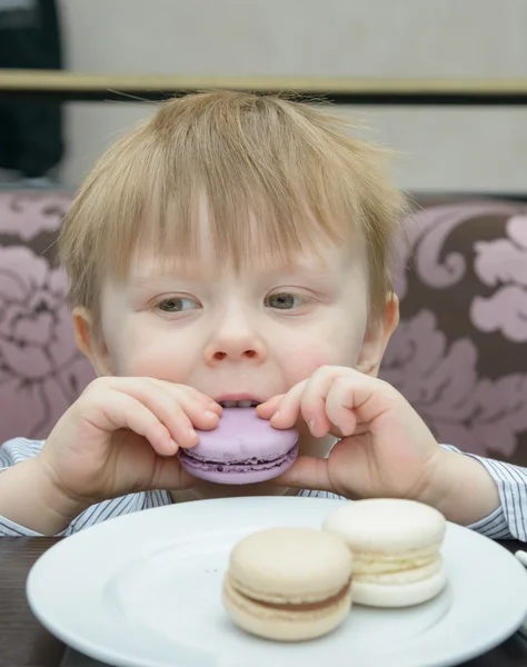 Little boy eating cake