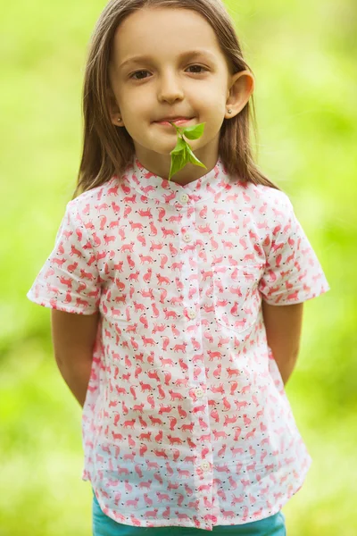 Portrait of funny and sweet little girl with long light brown hair