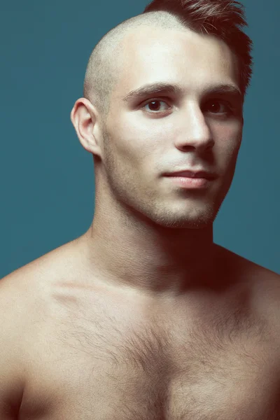 Male beauty concept. Portrait of handsome muscular male model po