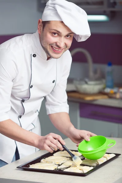 Vegetarian cooking concept. Portrait handsome smiling kitchener