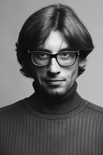 Stylish teacher, lecturer concept. Portrait of smiling young man in glasses