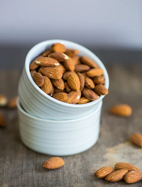 Almond on natural wooden table background