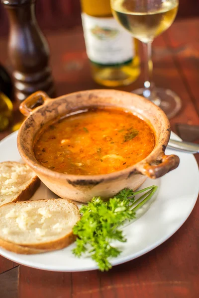 Fish soup with bread and garlic
