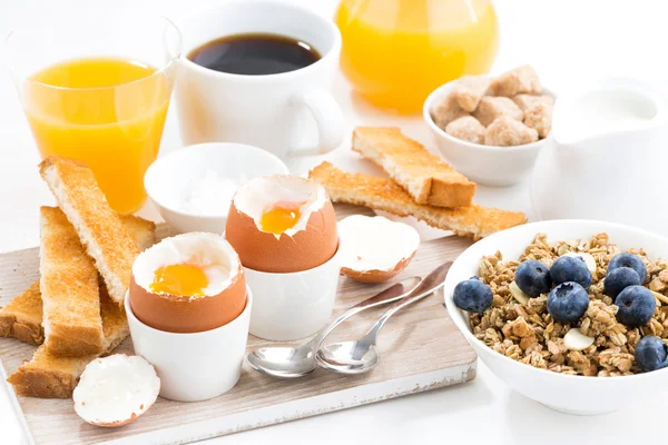 Delicious breakfast with soft boiled eggs and crispy toasts