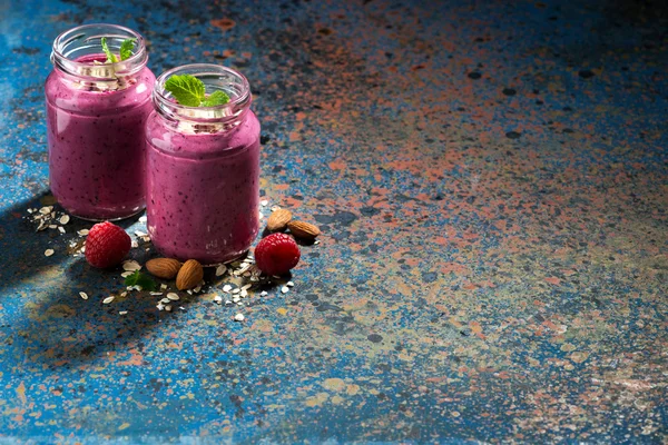Healthy berry smoothie and dark background