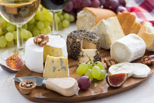 Cheese platter, snacks and wine
