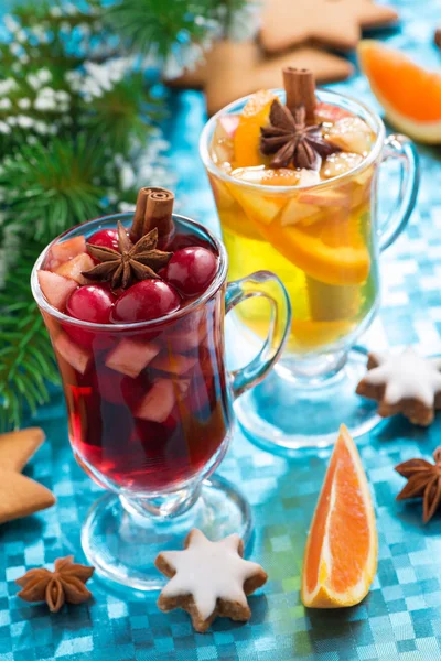 Christmas mulled wine and spiced apple cider on blue background