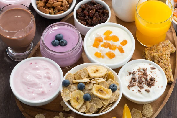 Rich breakfast buffet with cereals, yoghurt and fruit