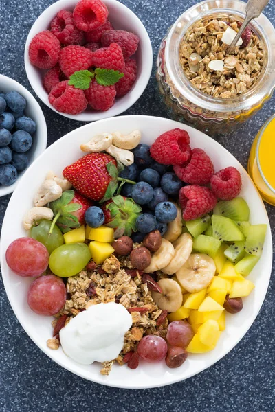 Fresh foods for a healthy breakfast - berries, fruits, nuts