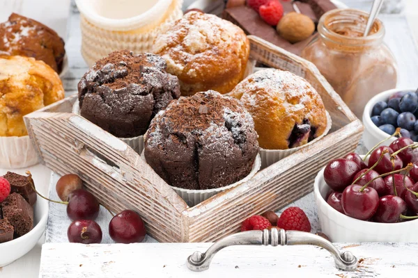 Assortment of fresh delicious muffins and fresh berries