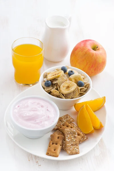 Healthy breakfast - cereal, fresh fruit, yogurt and juice