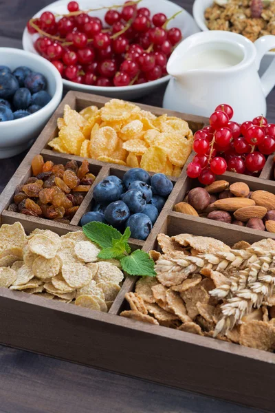 Breakfast cereal and other fresh ingredients in a wooden box