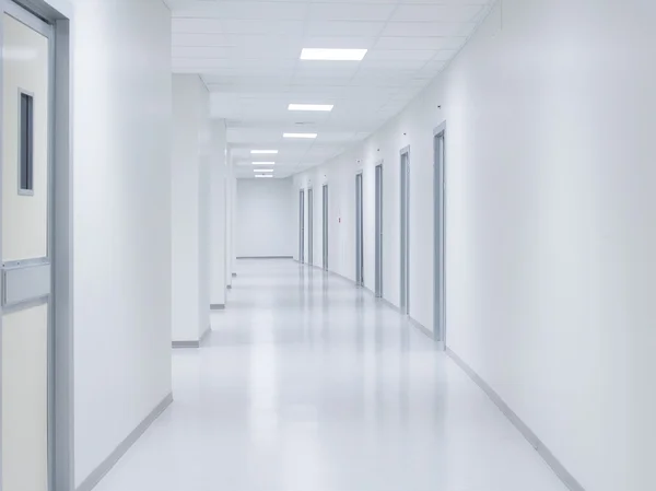 Empty white corridor background with doors