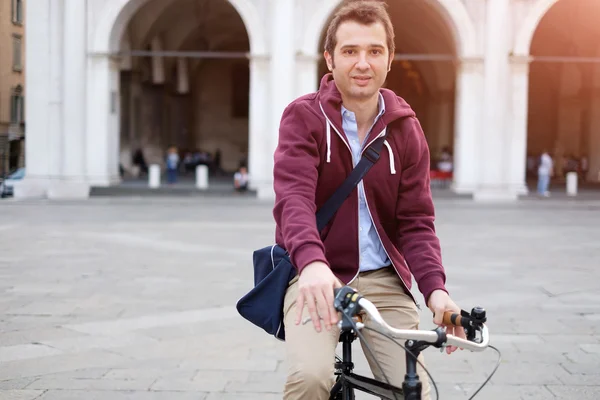 Man is riding his bike in the city