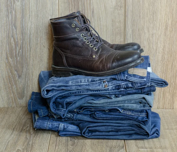 Pile of jeans and boots