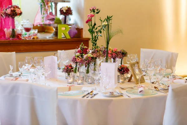 Elegant table set in soft pink for wedding
