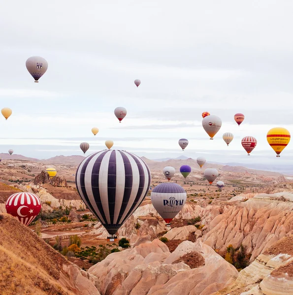 Goreme, Cappadocia, Turkey - October 24, 2015: The hot air balloon flight over the valley.