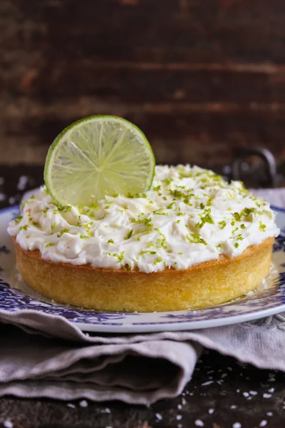 Pound cake with lemon, lime and freshly shredded coconut with cream cheese frosting
