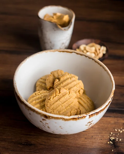 Cookies with peanut butter, nuts in a bowl, selective focus