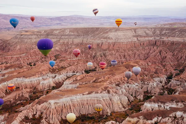 Goreme, Cappadocia, Turkey - October 24, 2015: The hot air balloon flight over the valley.