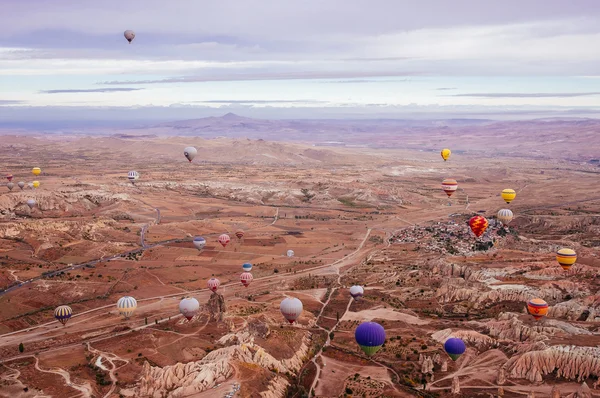 Goreme, Cappadocia, Turkey - October 24, 2015: The hot air balloon flight over the valley.