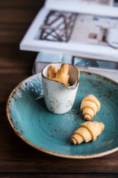 Homemade crescent rolls with sugar on a plate, selective focus