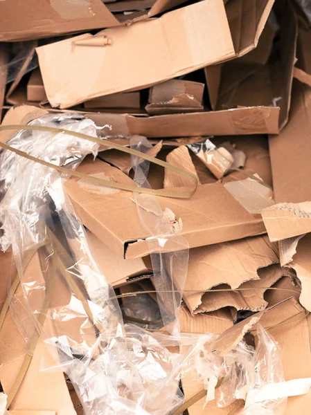 Pile or Stack of Empty Cardboard Boxed and Plastic Wrapping Mate