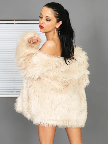 Attractive Young Woman Wearing a Fur Jacket