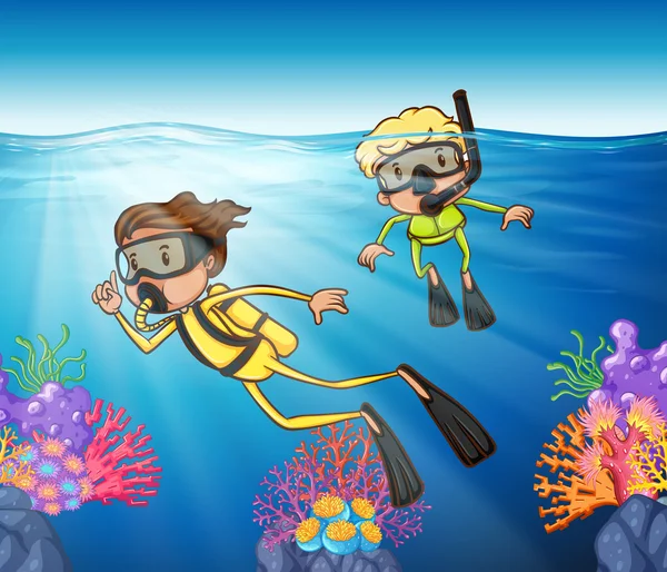 Two people scuba diving under the ocean