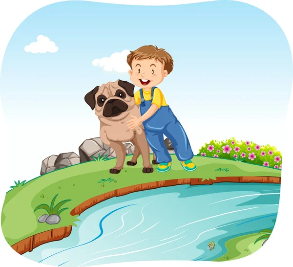 Little boy and dog by the river