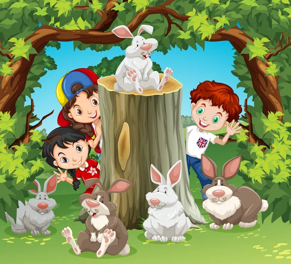 Children in the jungle with rabbits