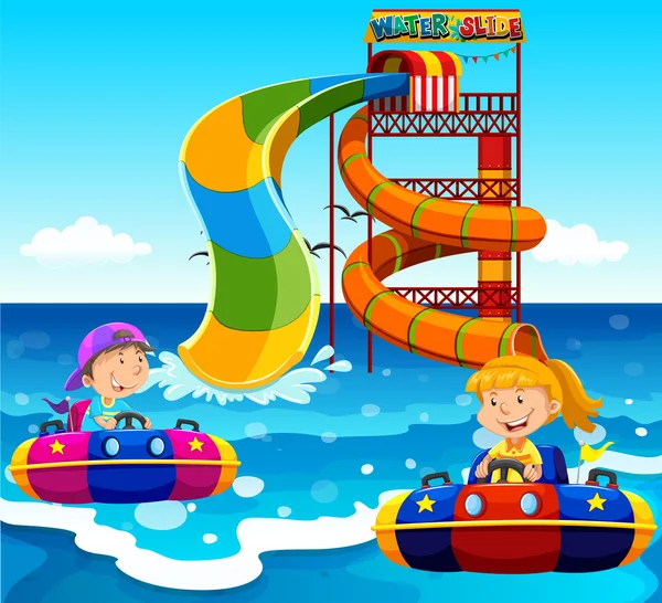 Boy and girl riding on water slide in the ocean