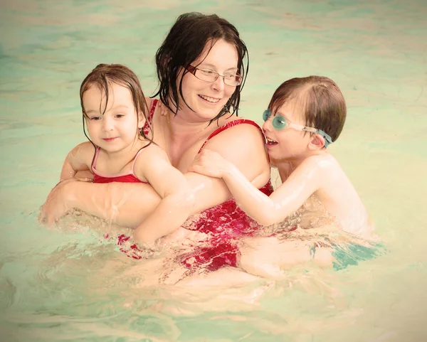 Family swimming together.