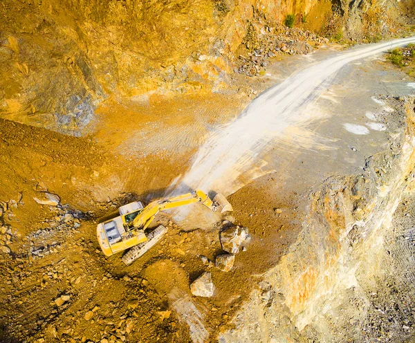 Aerial view of a excavator in the open cast mine.