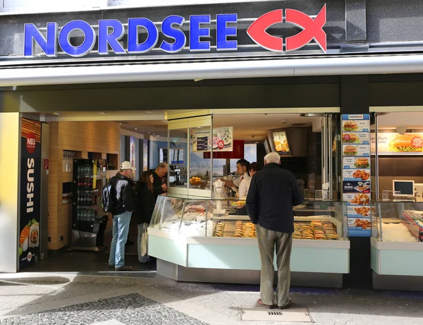 Customers buying food at Popular German Sea food Restaurant chain Nordsee