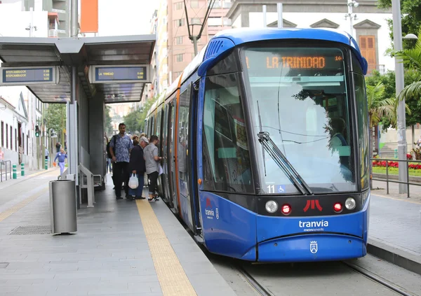 People getting on and off the Tenerife Tram Tranvia