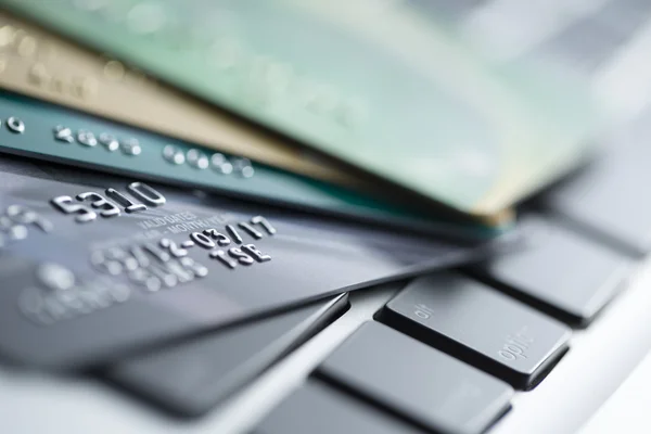 Credit cards on computer keyboard - Stock Image