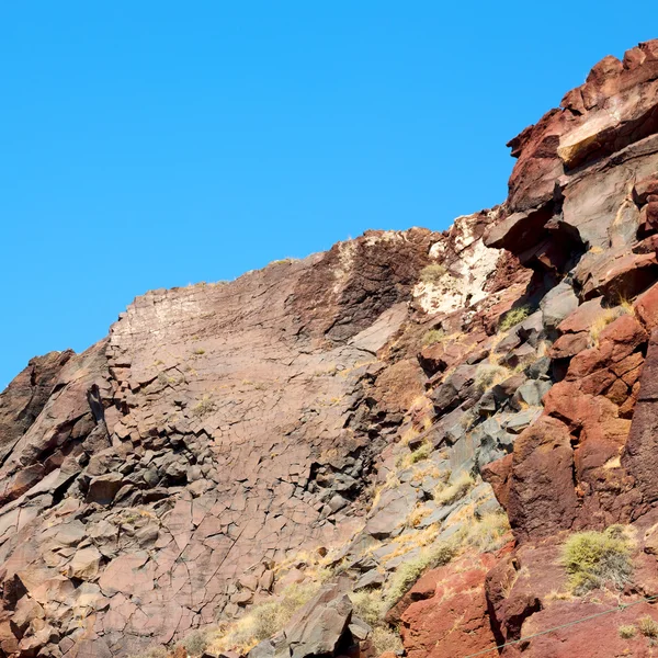 Rock alone in the sky santorini europe greece and dry bush