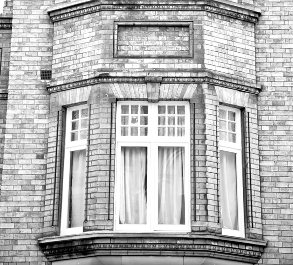 In europe london old red brick wall and      historical window