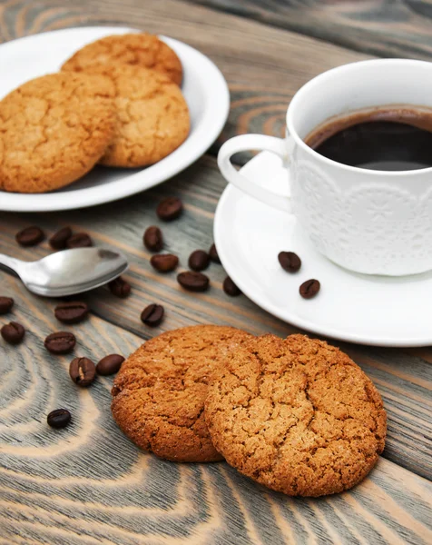 Cup of coffee and oatmeal cookies