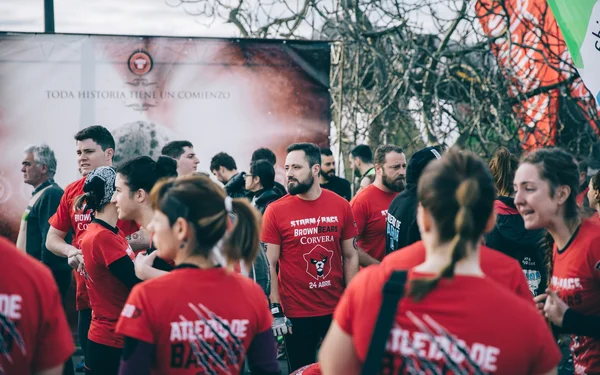 Runners team awaiting to start a extreme obstacle race in park