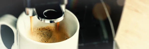 Coffee maker machine pouring Espresso