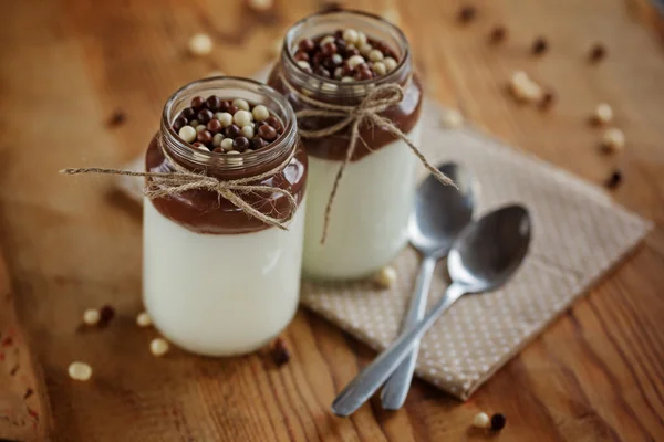 Delicious dessert with frozen yogurt and white, brown chocolate