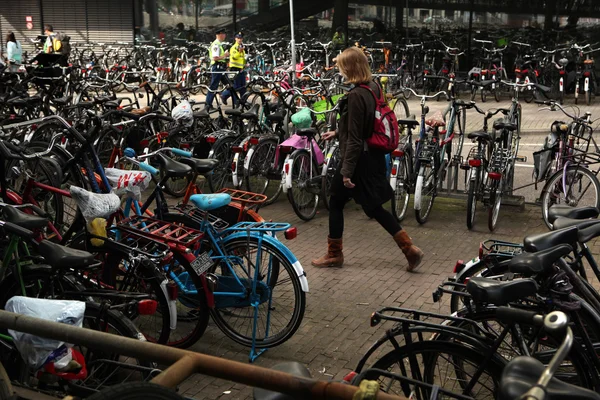 Woman walks through the bicycle parking station