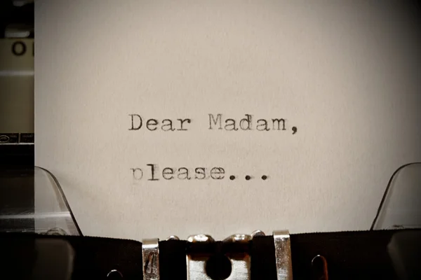 Text Dear madam typed on old typewriter