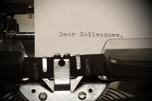 Text Dear Colleagues typed on old typewriter