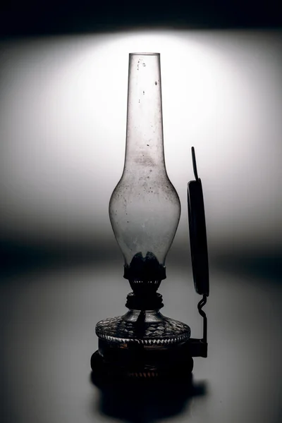 Old kerosene lamp isolated on white background