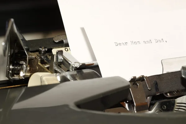 Text Dear Mom and Dad typed on old typewriter